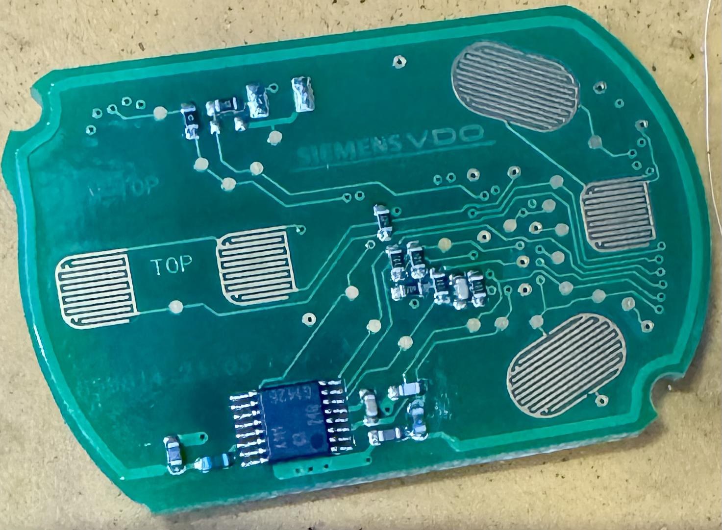 Internal button-contact side of the Corvette key-fob circuit board.